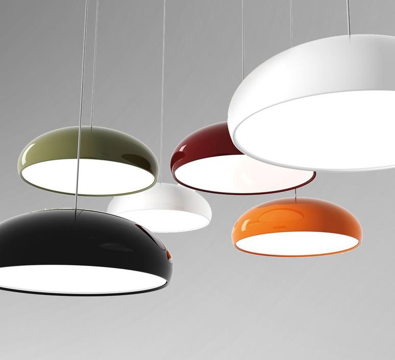 Group of dome pendants in several colours, including white, black, green, dark red and orange, hung at different heights from Clérachic.