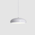 White Clérachic dome pendant on a light grey backdrop, with a softly glowing underside and a slim white cable.