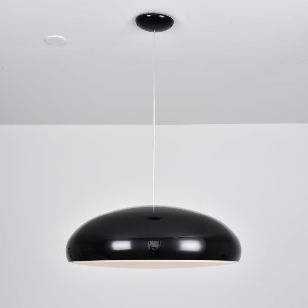 Black Clérachic dome pendant with a faint warm glow at its lower edge, hanging from a black ceiling canopy.