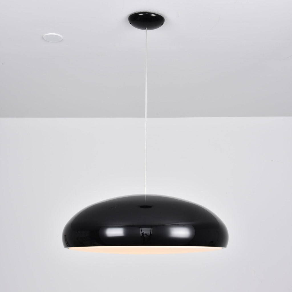 Black Clérachic dome pendant, side view, with a soft warm glow just visible under the shell and a spotlight overhead.