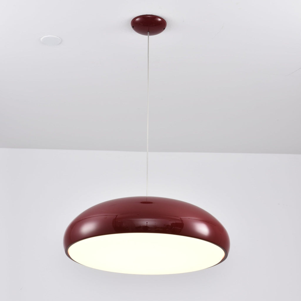 Dark-red Clérachic dome pendant lit from below, with a bright diffuser disc and a matching dark-red ceiling canopy.