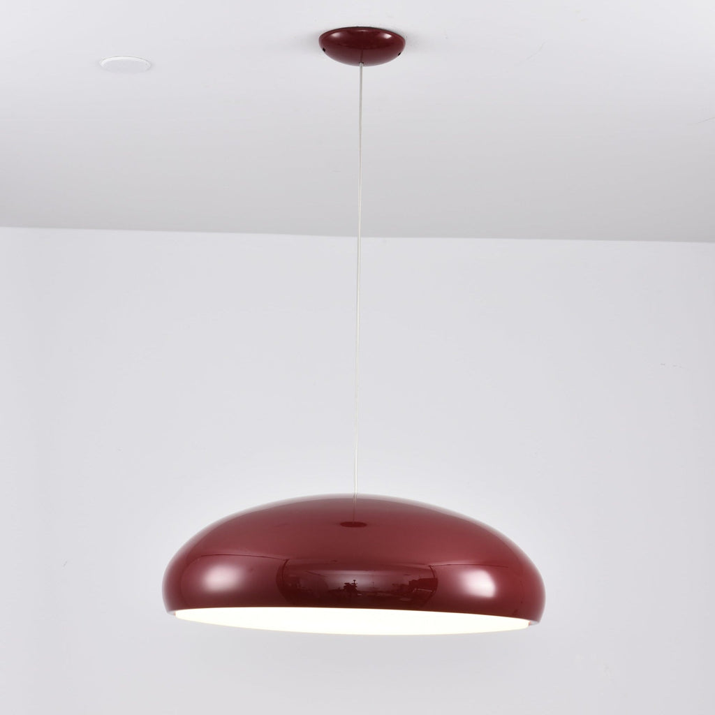 Dark-red Clérachic dome pendant with a bright white glow just showing at its lower edge, hung from a round canopy.