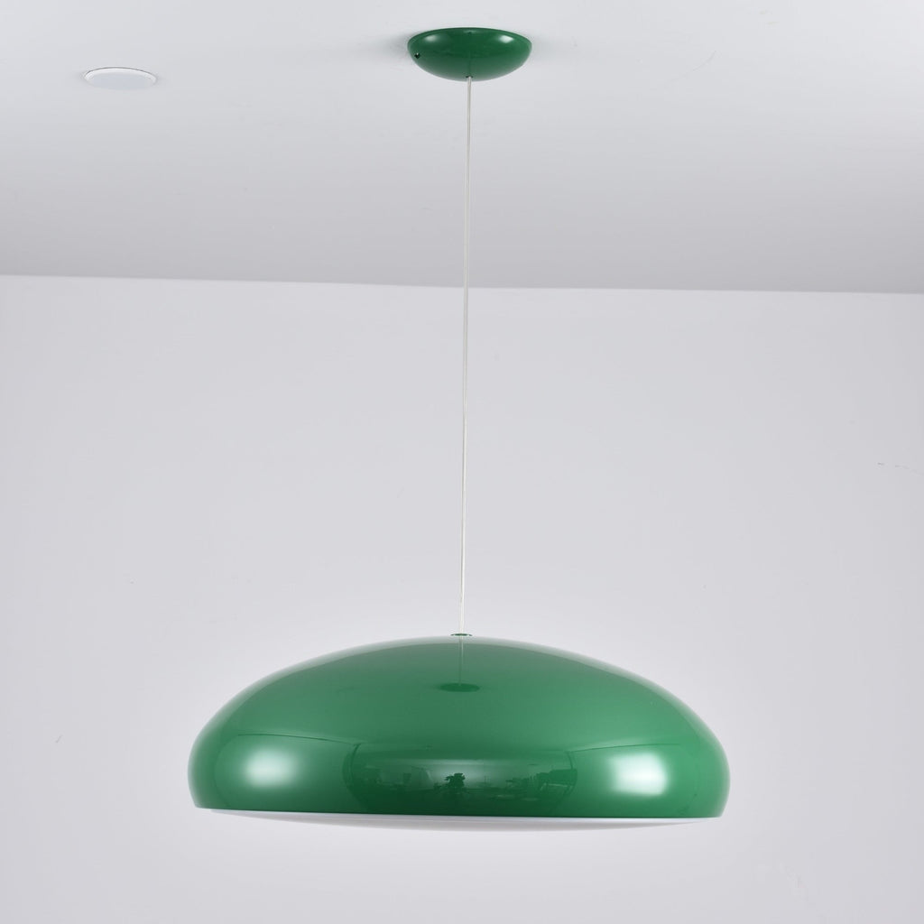 Green Clérachic dome pendant seen straight on, its rounded shell reflecting the room and a bright rim at the base.
