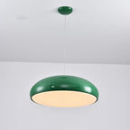 Wide green Clérachic dome pendant with a bright warm diffuser, hung from a matching green ceiling canopy.