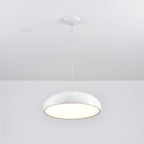 White Clérachic dome pendant seen from below with its diffuser glowing, hung from a white ceiling canopy.