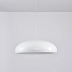 White Clérachic dome pendant viewed from slightly below, its grey inner disc unlit and its shell glossy.