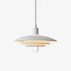 White three-tier Clérachic pendant on a plain light backdrop, with a white coiled cable and a small loop handle under the lowest shade.