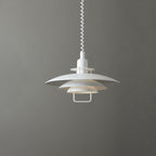 White Clérachic pendant on a mid-grey backdrop, its three round shades stacked beneath a white coiled cable.