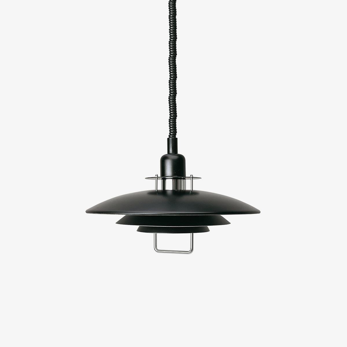 Black Clérachic pendant on a pale grey backdrop, with a black cable and a metal loop handle under the bottom shade.