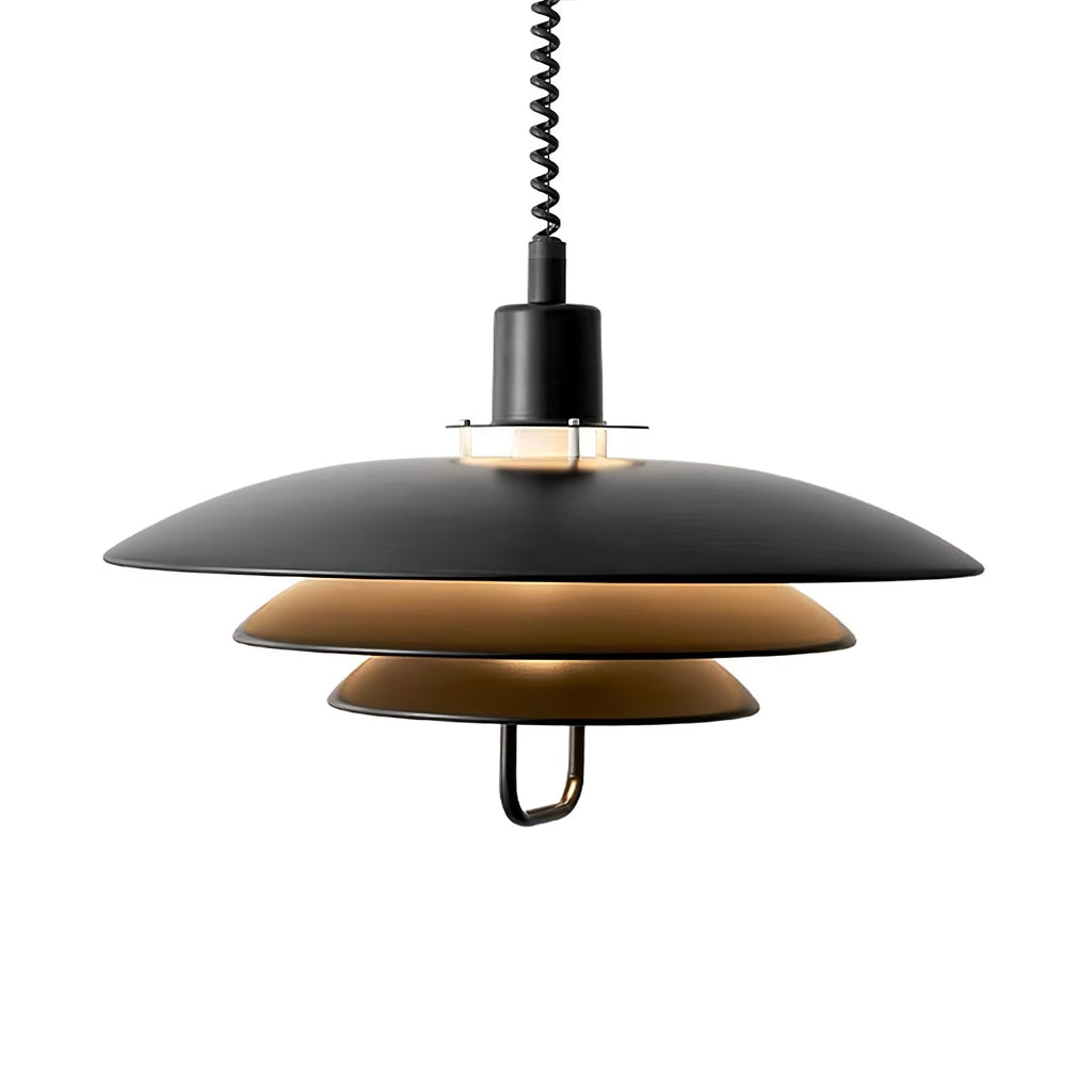 Black Clérachic pendant with a warm tan inner shade, lit from within, on a white backdrop.