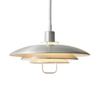 Silver aluminium Clérachic pendant on a white backdrop, with a pale inner shade and a white coiled cable.