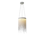 Clérachic chain-tassel pendant on a white backdrop, with a round ceiling plate and two cords above the glowing ring.