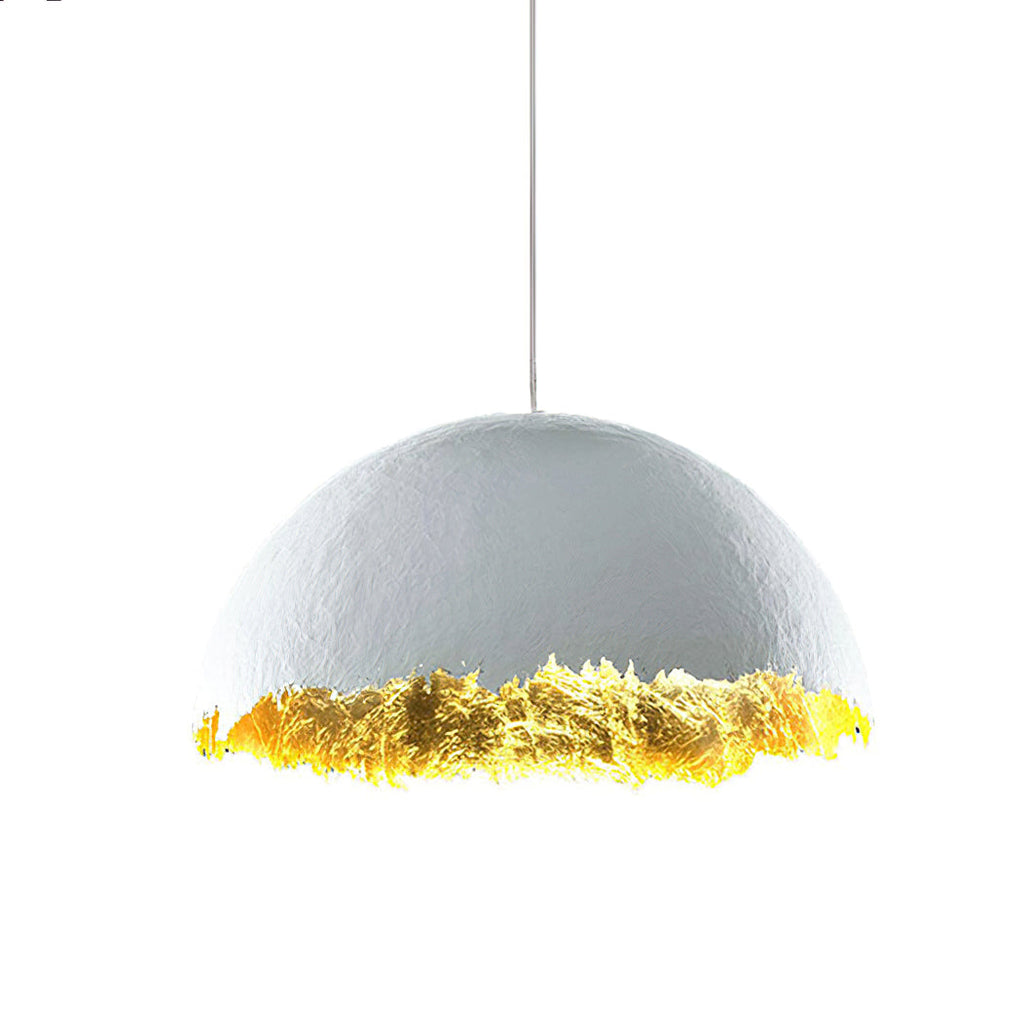 Side view of a Clérachic dome pendant with a textured white shell and a gold-leaf rim, on a plain white backdrop.