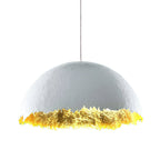 The widest version of this Clérachic dome pendant, with a pale textured shell and gold leaf along its jagged rim.