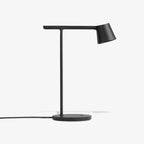 Black Clérachic table lamp on a white backdrop, seen side-on with its cord running out to the left.
