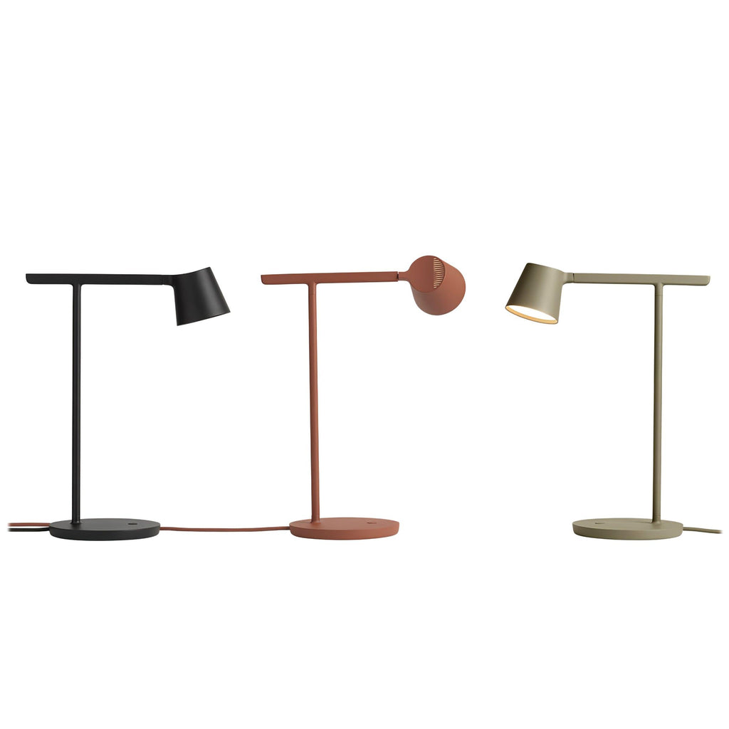 Three of this Clérachic table lamp in black, rust-red and olive, side by side on white, the red one's head tilted back.