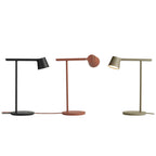 Three of this Clérachic table lamp in black, rust-red and olive, side by side on white, the red one's head tilted back.