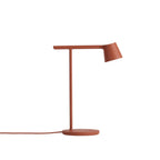 Rust-red Clérachic table lamp on a white backdrop, with a matching red cord running to the left.