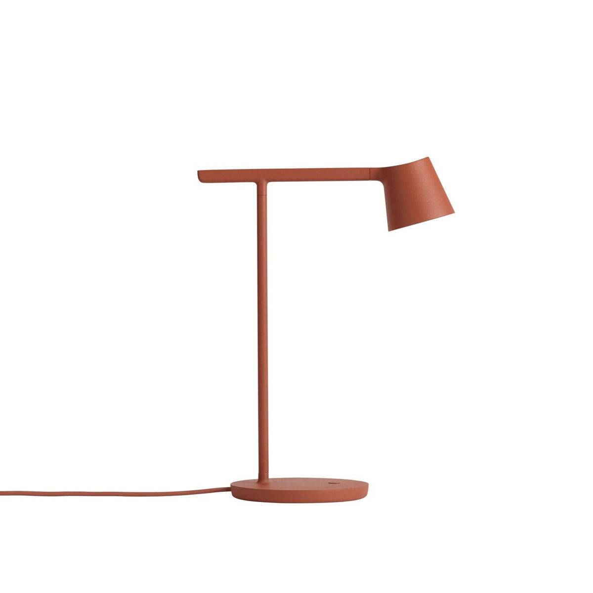 Rust-red Clérachic table lamp on a white backdrop, with a matching red cord running to the left.
