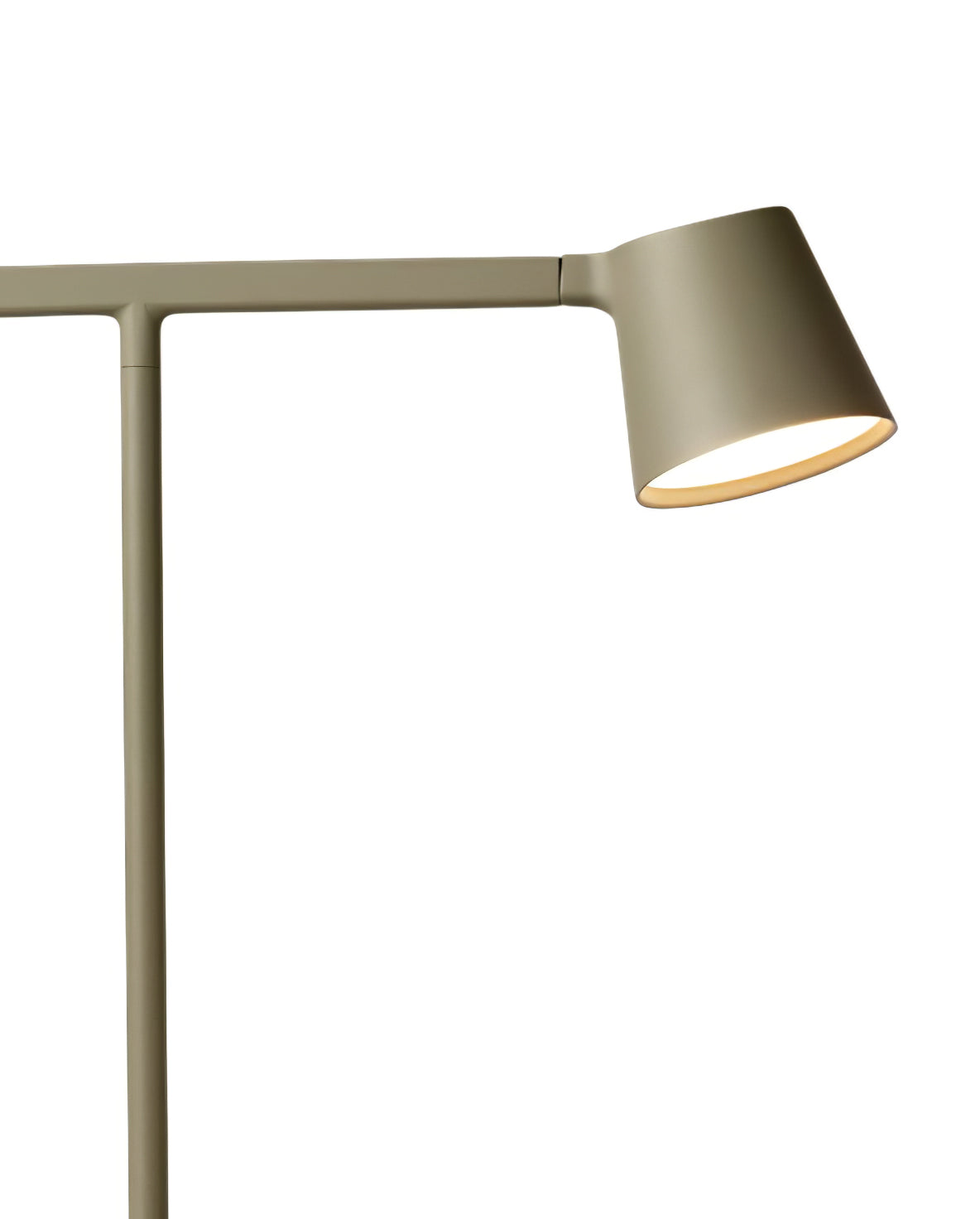 Close view of the olive head of this Clérachic table lamp, lit from within, on a white backdrop.