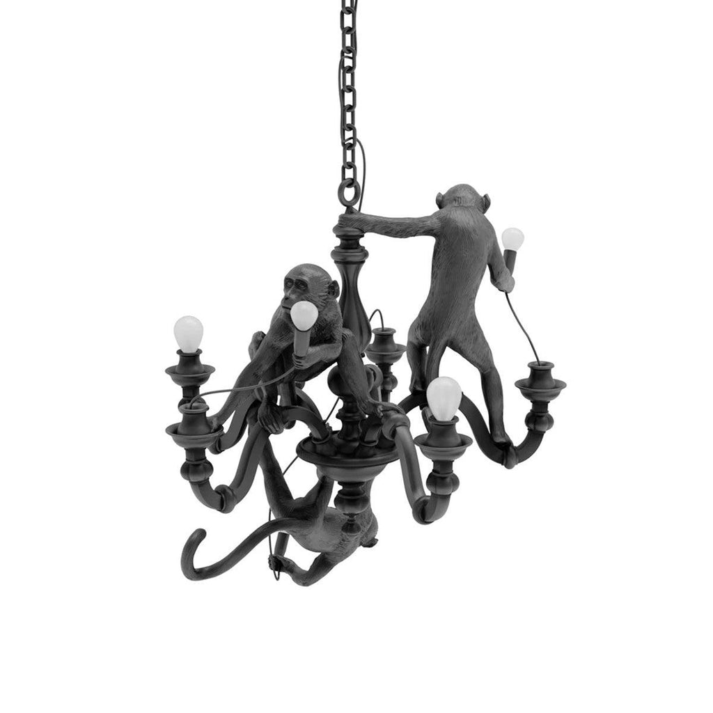 Black Clérachic monkey chandelier on a chain, its bulbs unlit, photographed straight on against a clean white background.