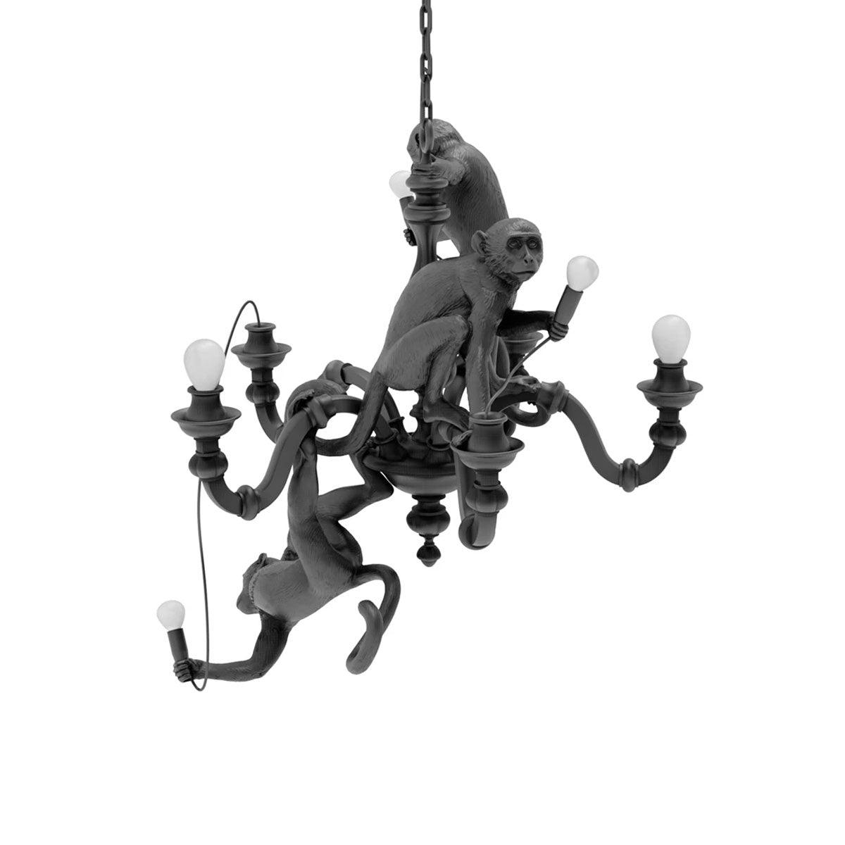 Black Clérachic chandelier with its monkeys and unlit bulbs, shown on a white backdrop from a slightly different angle.