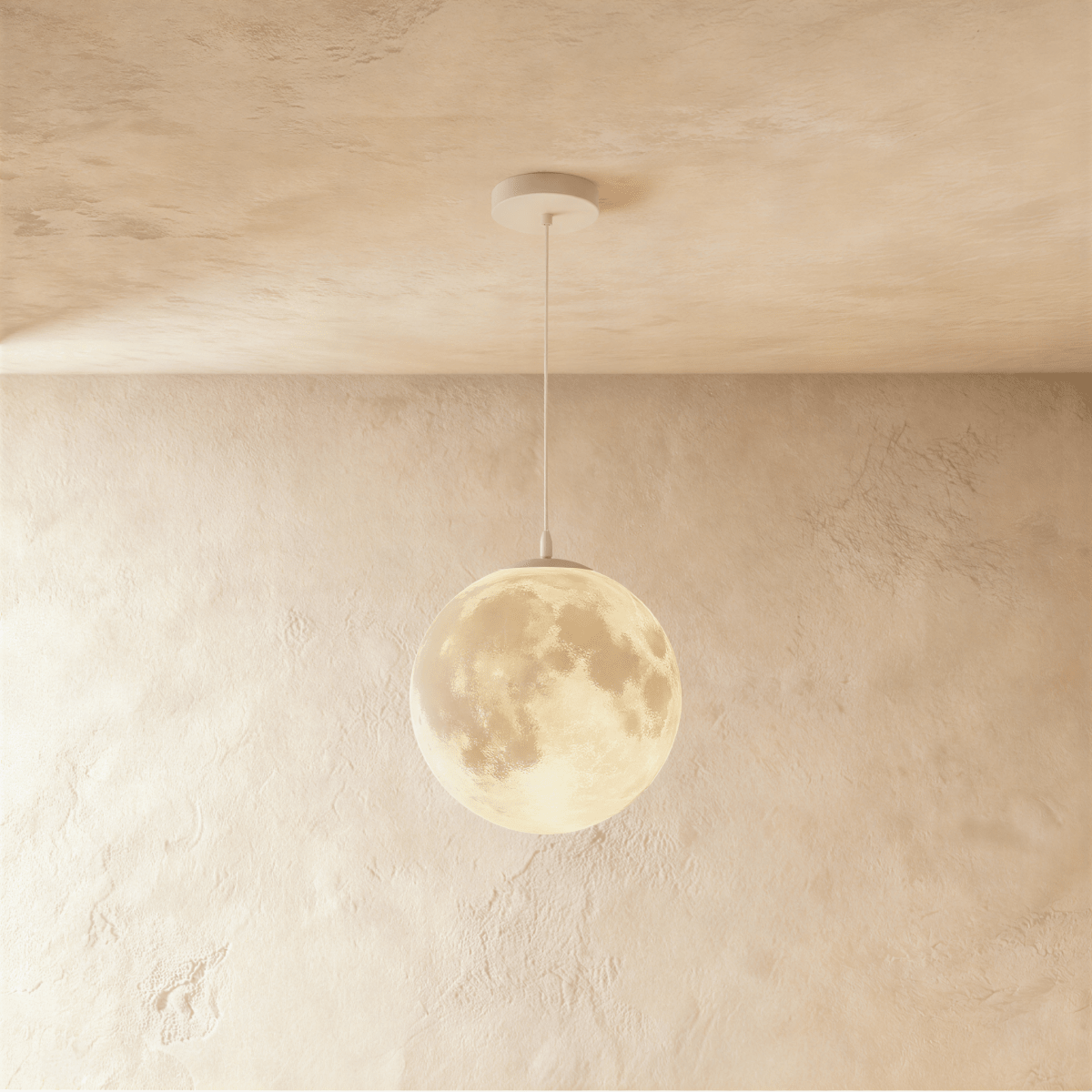 Clérachic moon pendant in a larger size, its crater-textured sphere glowing warm on a white cord from a round white canopy.