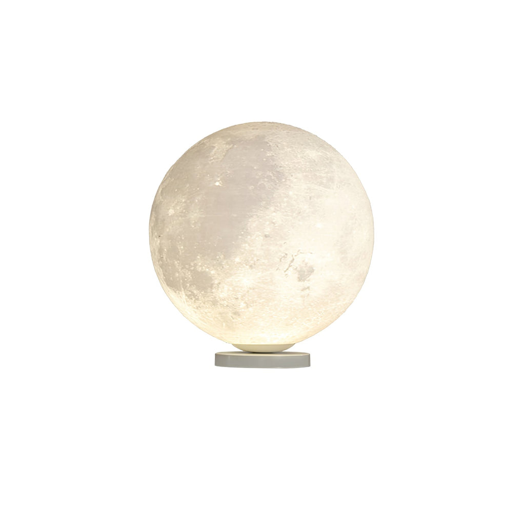 Clérachic moon table lamp glowing from within, with a crater-textured surface above a slim round base, on a white backdrop.