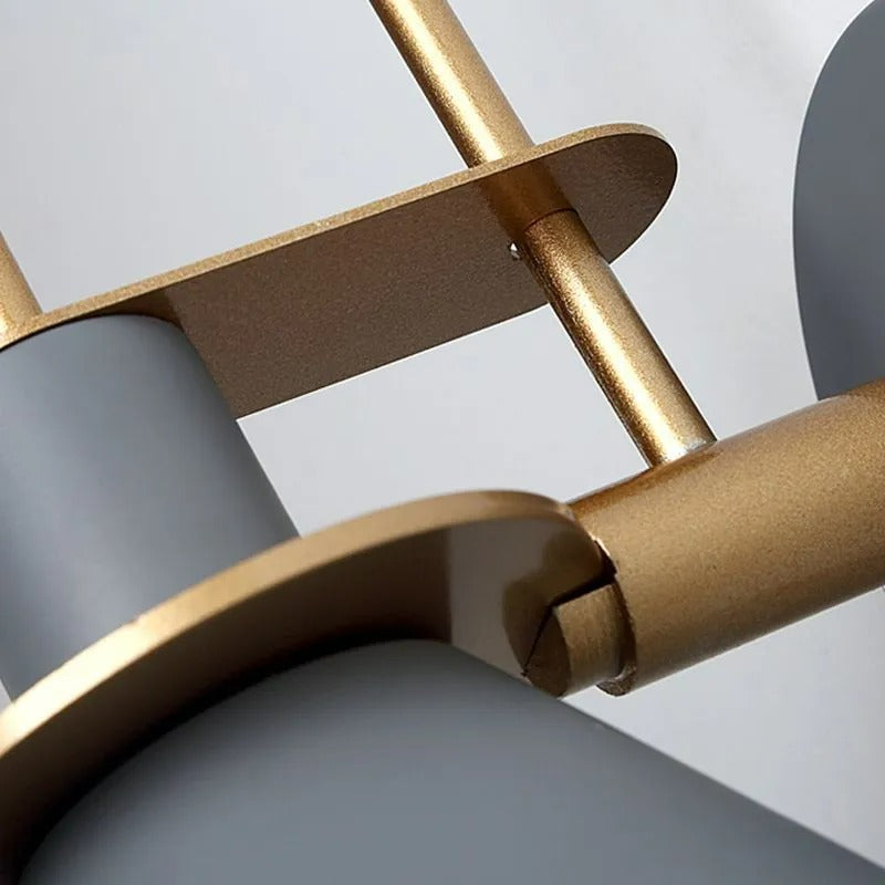 Detail of the Clérachic Morandi horn-shade wall sconce's slotted brass bracket, the joint that lets the cone tilt on its arm.