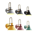 All six colourways of the Clérachic Morandi horn-shade wall sconce — white, grey, black, yellow, pink and green — on shared brass hardware.