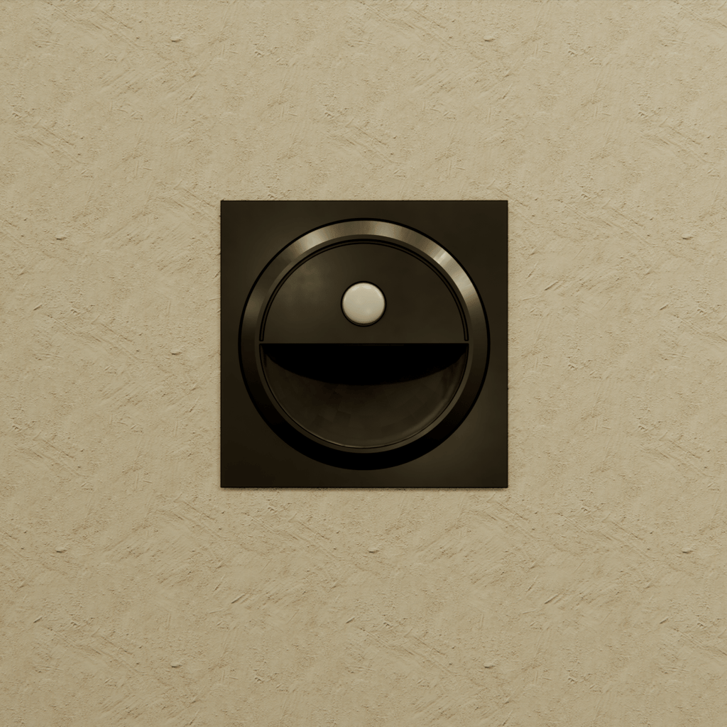 Clérachic black square stair light unlit on a textured sand-coloured wall, with its round sensor above the recess.