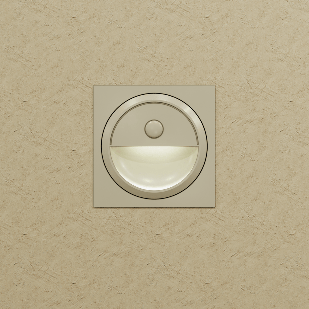 Clérachic pale square stair light on a textured sand wall, its half-moon recess glowing a soft white.