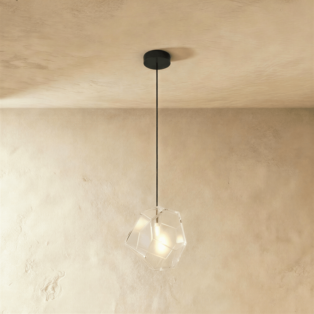 This Clérachic pendant's clear faceted glass shows its exposed bulb plainly through the angled cut panes.