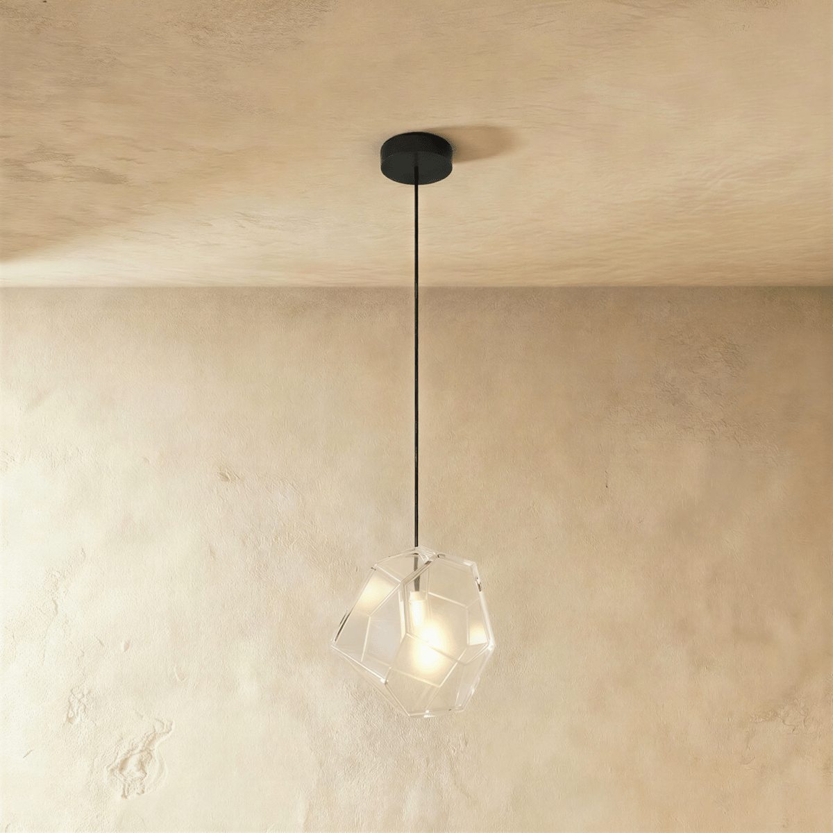 This Clérachic pendant's clear faceted glass shows its exposed bulb plainly through the angled cut panes.