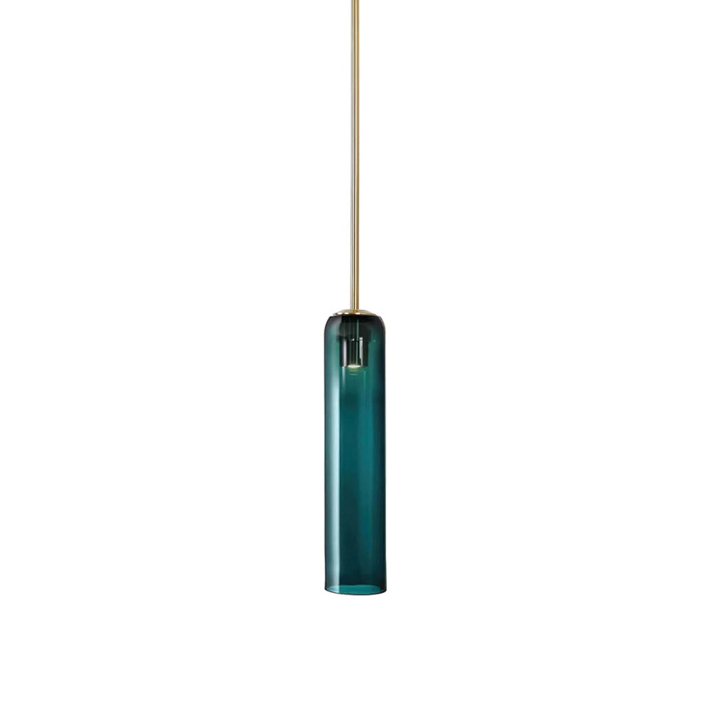 Green mouth-blown glass on the Clérachic tube pendant, lit on a brass rod, its deep teal tone shown against white.