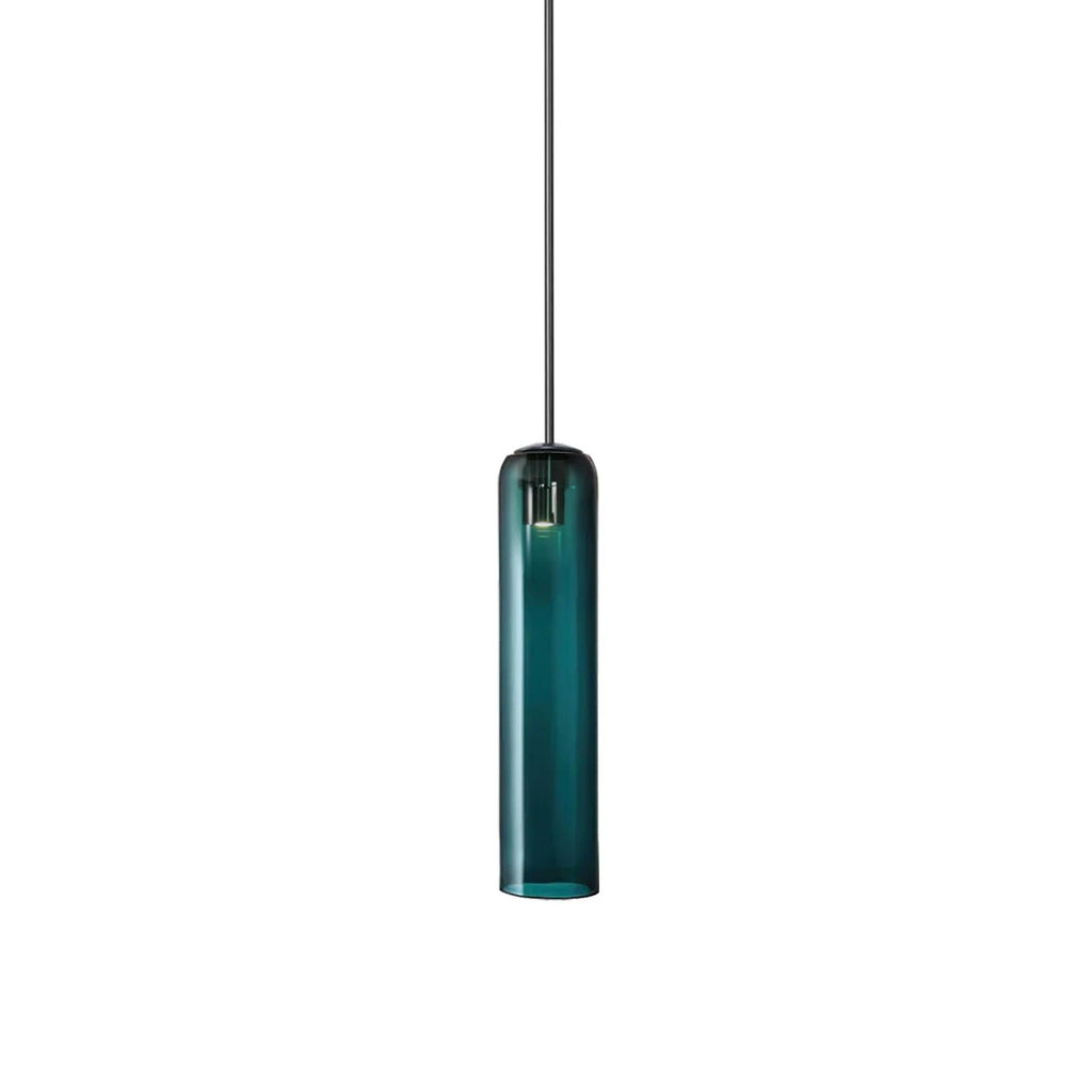 The same green Clérachic glass tube pendant lit on a black rod, the brass bulb holder visible at the top.