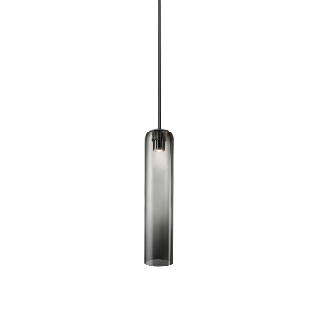 The smoke grey Clérachic glass tube pendant lit on a black rod, its dark collar meeting the stem at the top.