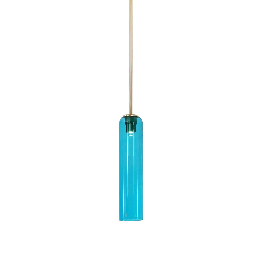 Sky blue glass on the Clérachic tube pendant, lit on a brass rod, the bright translucent shade deepest at the collar.