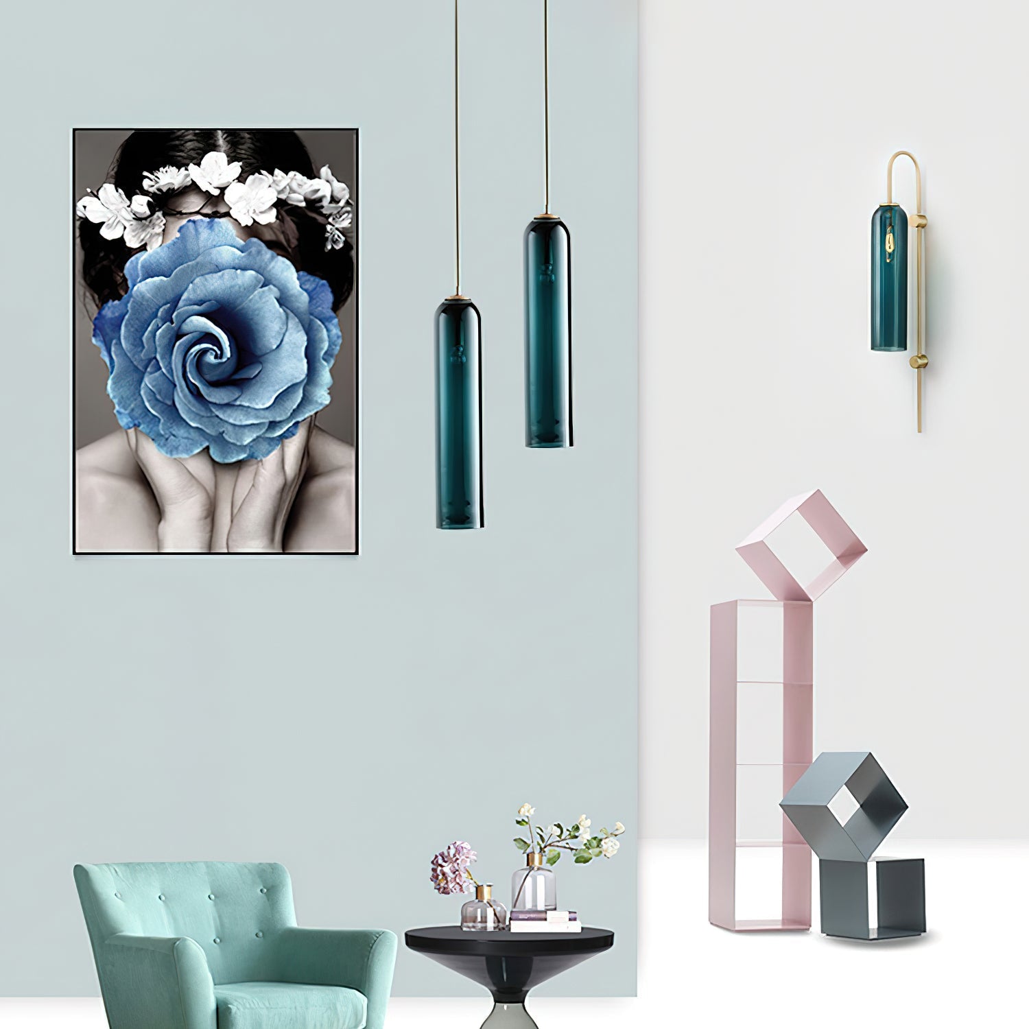Two green Clérachic tube pendants and a matching wall sconce lit in a styled room with sculptural shelf decor.