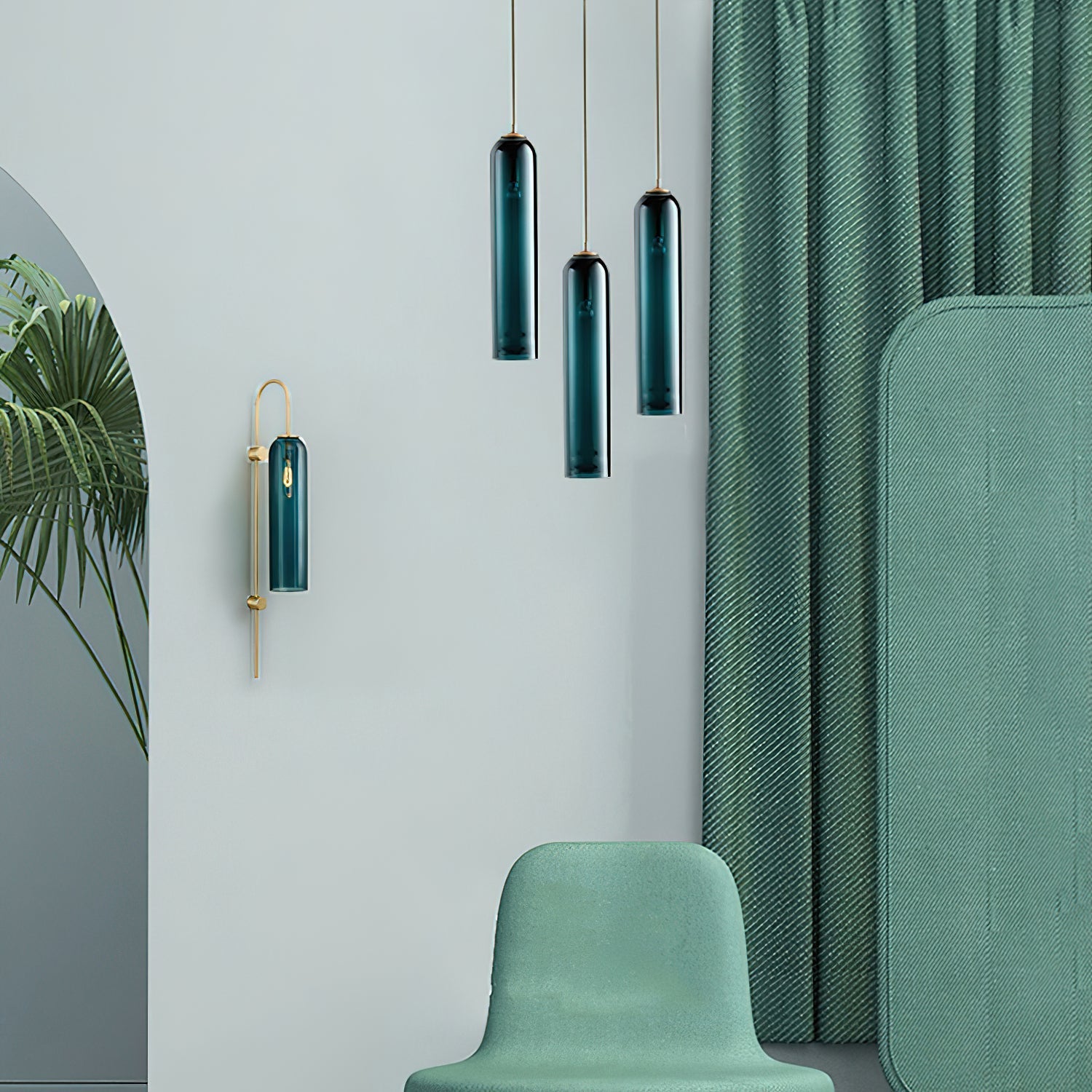 Three green Clérachic glass tube pendants at staggered heights, lit beside a matching wall sconce and green curtain.