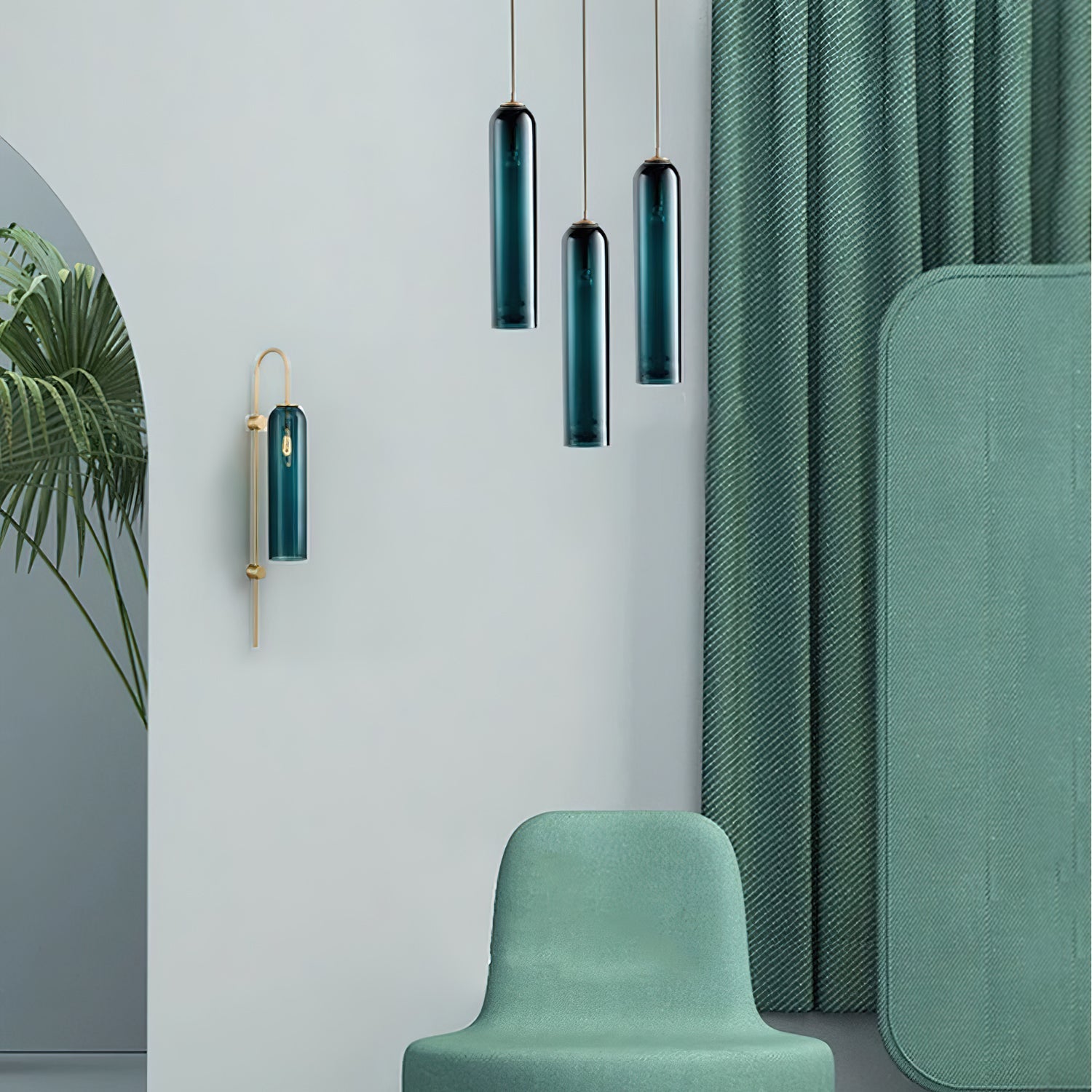 A closer view of the staggered green Clérachic pendants and wall sconce against the green curtain and armchair.