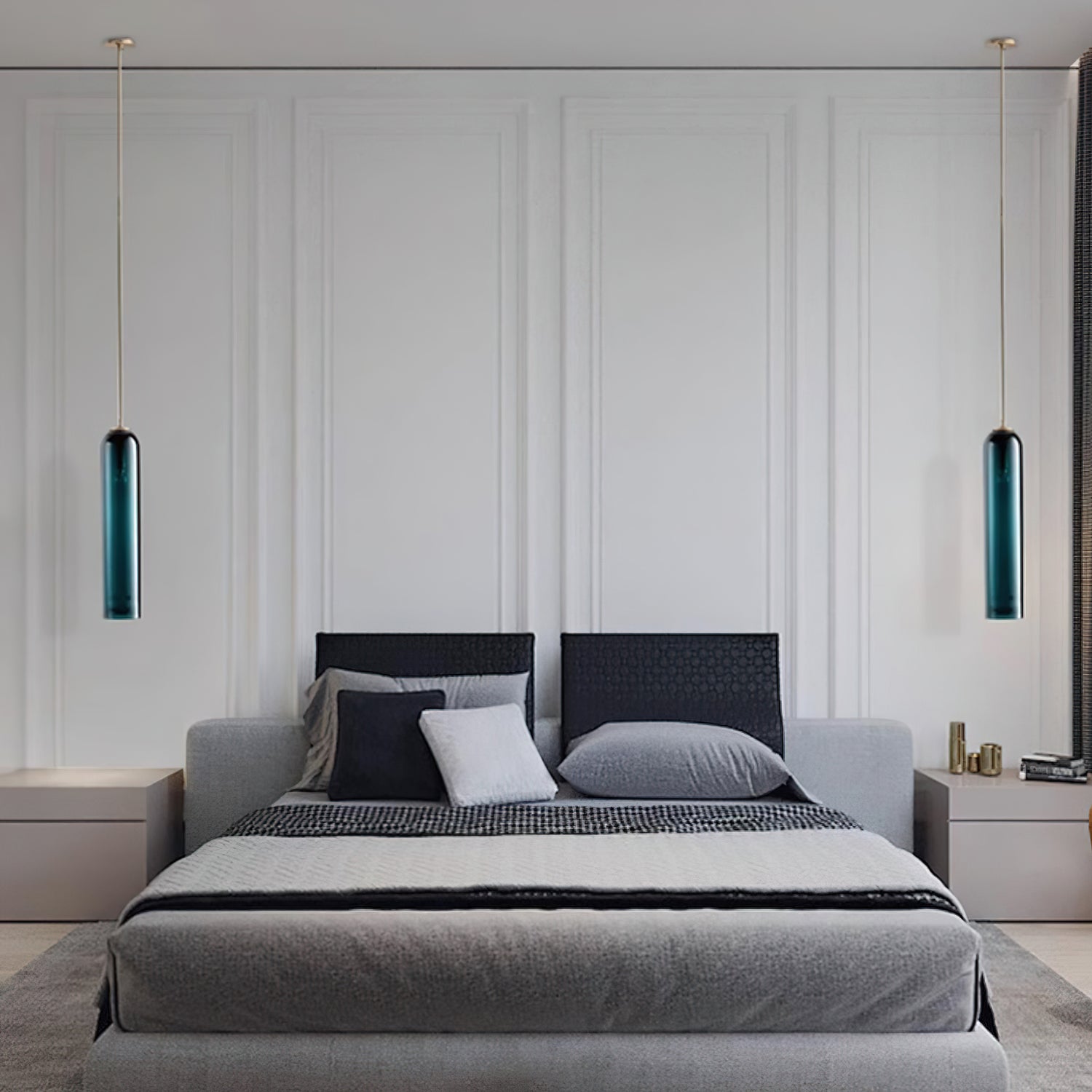 Two green Clérachic glass tube pendants flank a panelled headboard, lit above matching bedside cabinets.