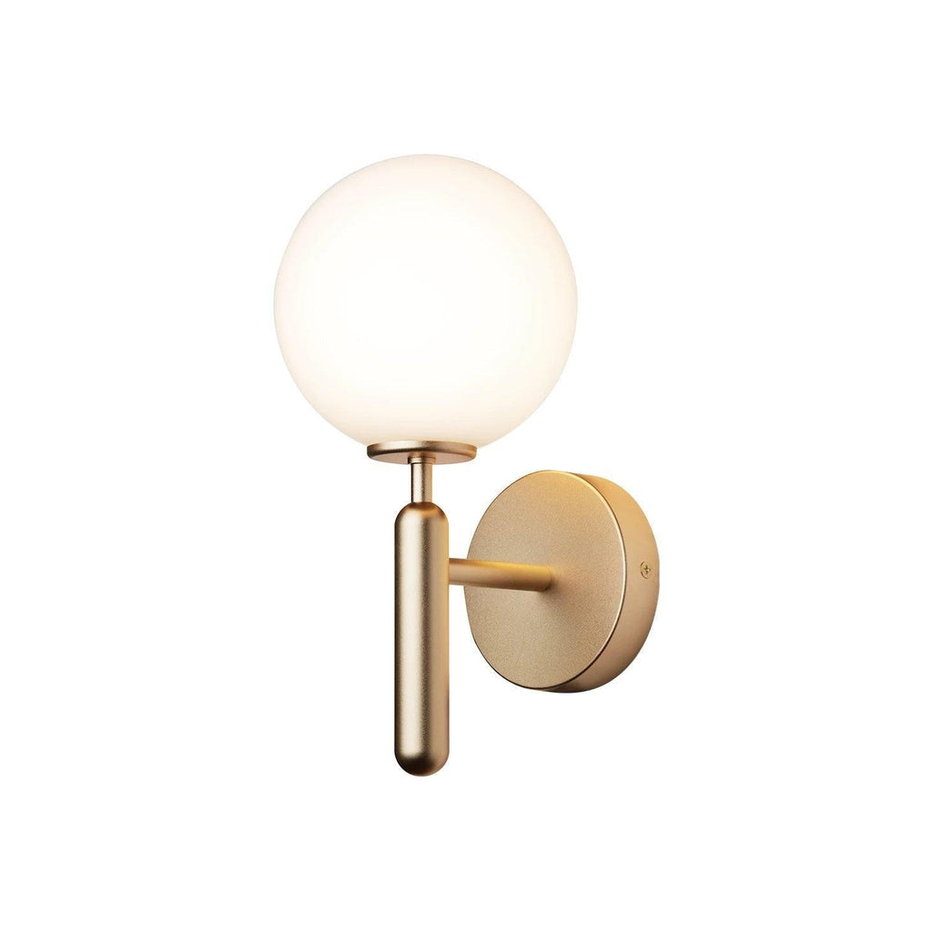 Set squarely against a plain white background, this brass Clérachic wall light's white glass globe and arm are fully visible.