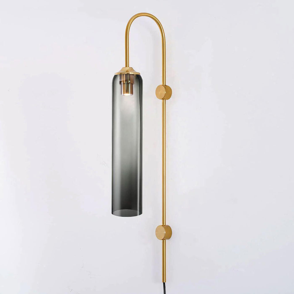 Smoke grey glass on the Clérachic mouth-blown wall sconce, its gold rod fixed to the wall at two points down its length.