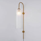 Milky white glass on the Clérachic mouth-blown wall sconce, diffusing the bulb into an even glow along the whole cylinder.
