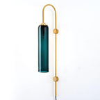 Clérachic mouth-blown glass wall sconce in deep teal, unlit, showing how saturated the colour sits before you switch it on.