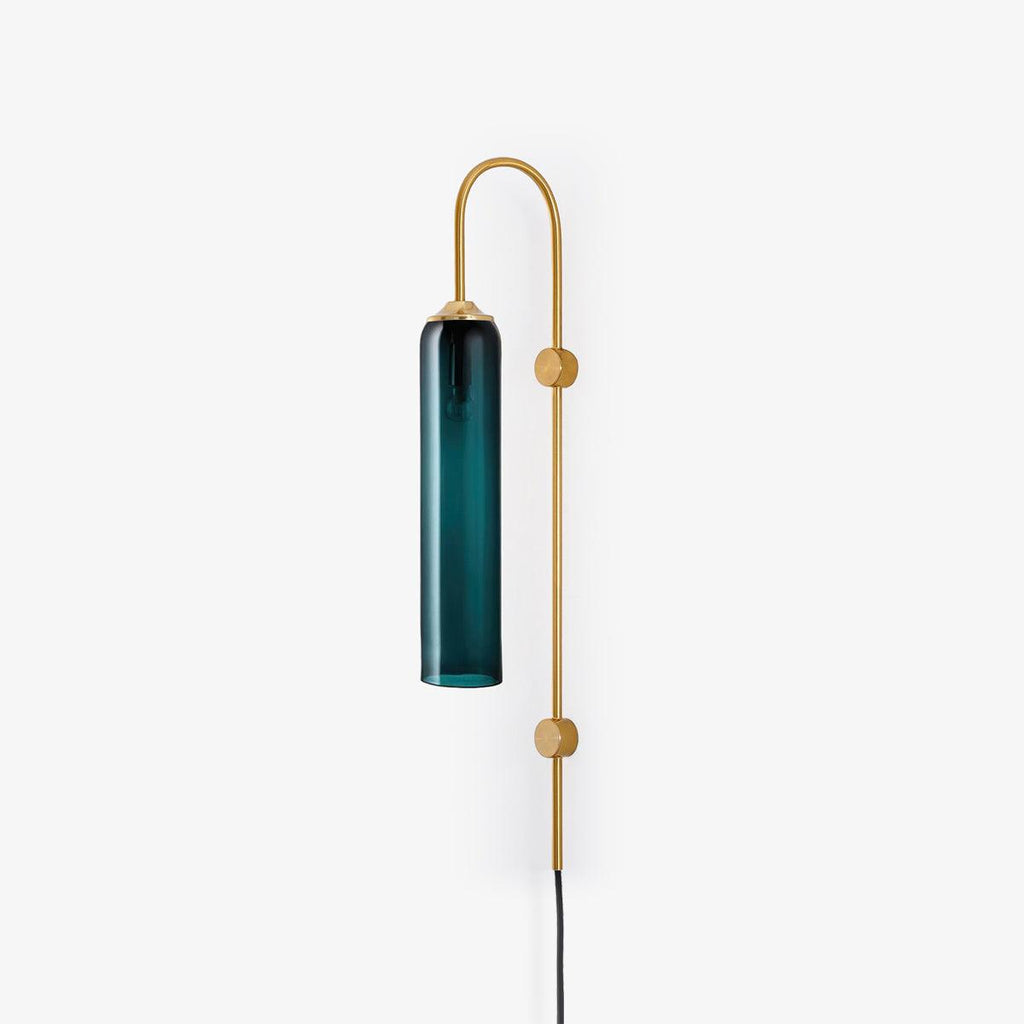 Clérachic mouth-blown glass wall sconce in deep teal on gold, photographed small in frame to show the full 80 cm drop.
