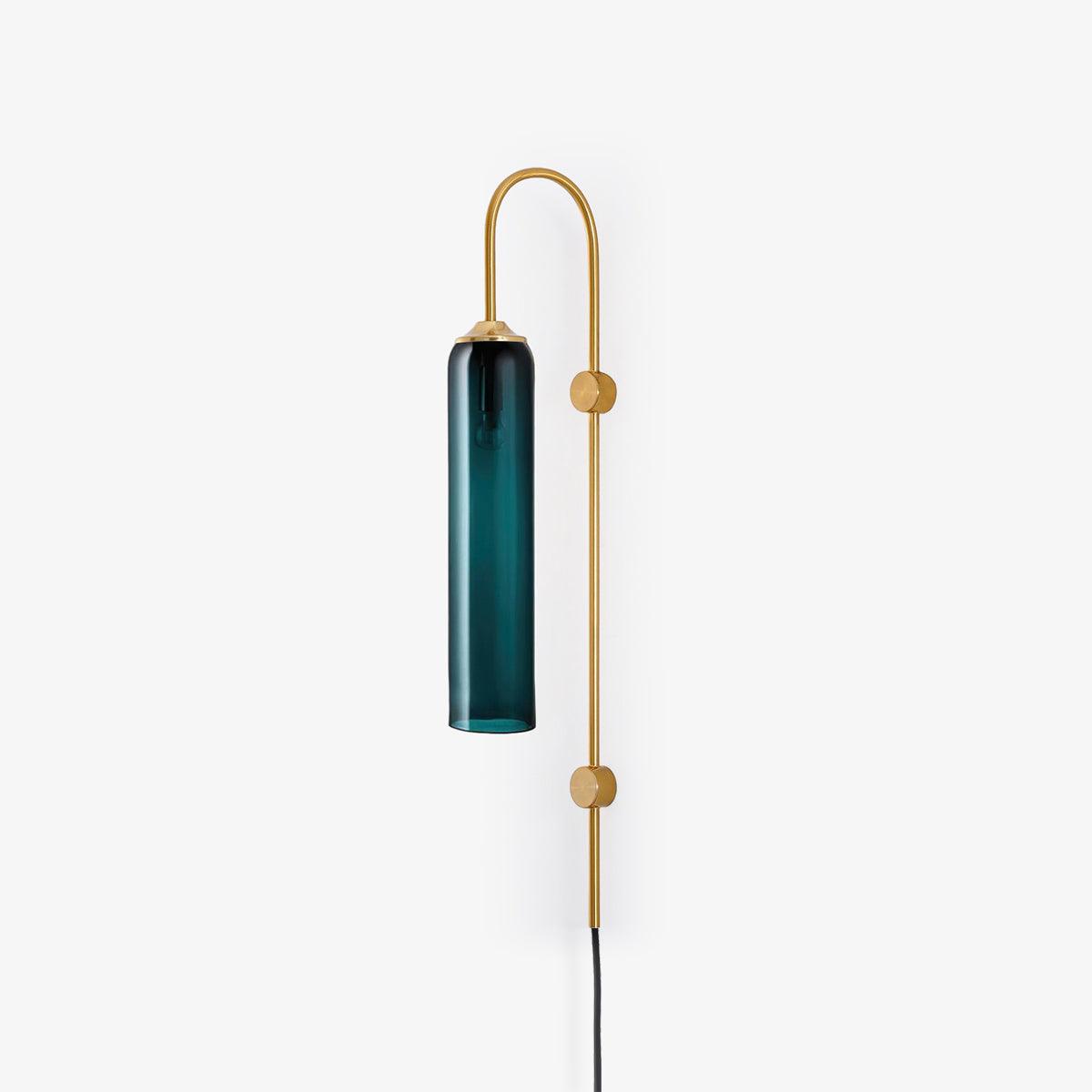 Clérachic mouth-blown glass wall sconce in deep teal on gold, photographed small in frame to show the full 80 cm drop.