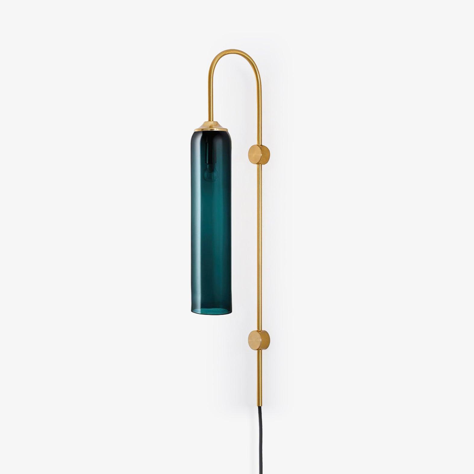 Clérachic mouth-blown glass wall sconce in deep teal, unlit, the bulb sitting high inside the hand-blown cylinder.