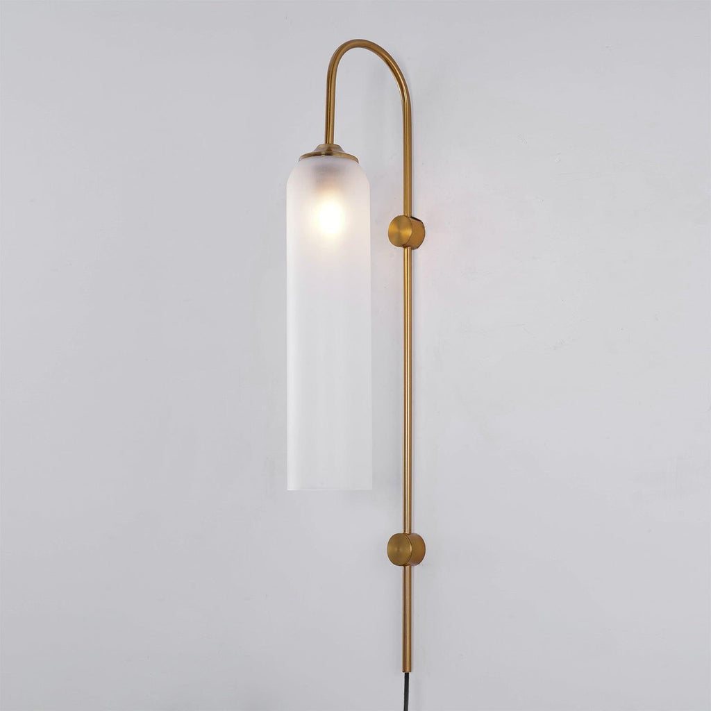 Clérachic mouth-blown glass wall sconce in frosted white on gold, the bulb blooming as a soft halo near the top.